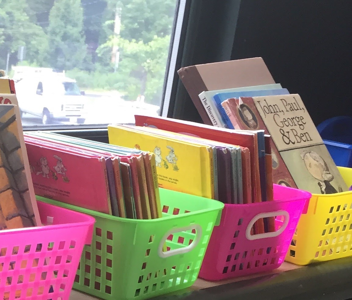 Flexible Seating Storage neon baskets with books